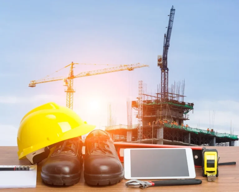 Construction Safety Gear and Tools with High-Rise Site Background