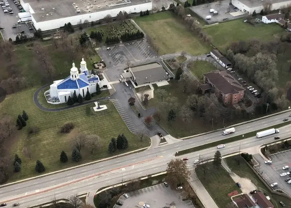 High aerial drone view of a commercial facility site managed by Epic Construction Management.
